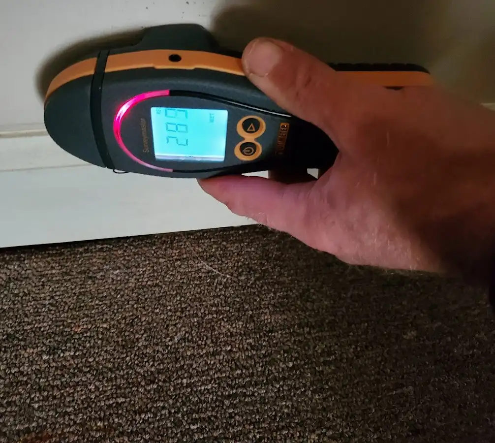 Moisture detection at baseboard during Storm Damage Restoration in Waupun